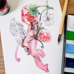 a drawing of a pink fairy sitting on top of a table next to watercolor paints