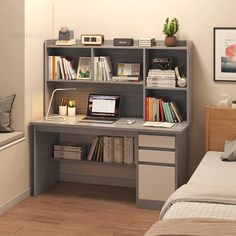 a bedroom with a bed, desk and bookshelf next to a small window