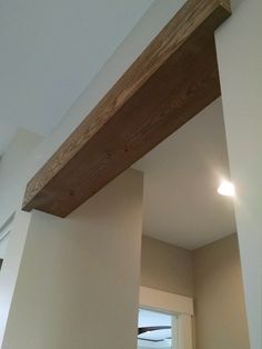 a wooden beam in the corner of a room