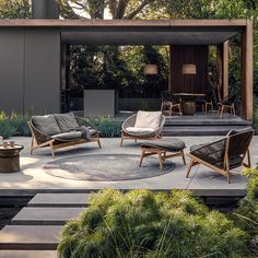 an outdoor living area with furniture and plants