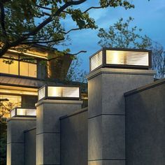 three lights on the top of some concrete structures