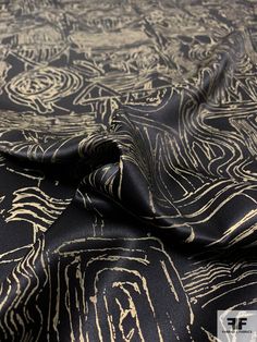 This interesting silk charmeuse fabric is gold foil printed with an archeological inspired design. The foil print gives the fabric a bit of "crispiness" and as a result, this charmeuse moves and drapes unlike a typical silk charmeuse. We highly encourage ordering a swatch first! SKU: 12538 Content: 100% Silk Color: Antique Gold / Black Width: 44 inches This fabric is a last cut and no longer in production. Once sold out, we are unable to get more. Foil Print Fabric, Wardrobe Colour, Black And Gold Aesthetic, Gold Wallpaper Background, Background Pics, Charmeuse Fabric, Beautiful Background, Gold Aesthetic, Fabric Textures