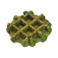 a miniature model of a cross made out of moss