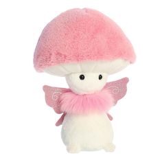 a small stuffed animal with pink wings and a mushroom on it's back,