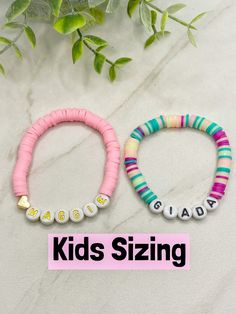 "Kids Heishi Bracelet | Girls Name Bracelet | Girls Personalized Custom Bracelet | Kids Beaded Bracelet | Toddler Jewelry | Kids Gifts If you would like the silver heart heishi bracelet, please follow this link: https://www.etsy.com/your/shops/IndigoandIvyUS/tools/listings/stats:true/1305088002 Products Details: - This listing is for ONE Heishi disc beaded bracelet for kids. - If size is not entered at checkout bracelet will come in standard 6\" size. Letter bead will be white with black if not Personalized Pink Fun Beaded Bracelets, Fun Pink Name Bracelet With Letter Beads, Heishi Beads Name Bracelet As Gift, Playful Beaded Name Bracelet As Gift, Playful Pink Letter Beads Name Bracelet, Kids Bead Bracelet, Bracelet For Kids, Toddler Jewelry, Jewelry Kids