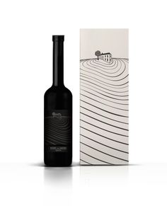 a bottle of wine sitting next to a box on a white surface with an image of a house in the background