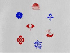 an image of different colored stickers on a white paper sheet with red, blue and green designs