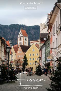 The main street in Füssen with a church tower and forested slope behind. Germany Poland, Famous Castles, Pedestrian Street, Castle Wall, City Museum, Tourist Information, Park Hotel, Booking Hotel