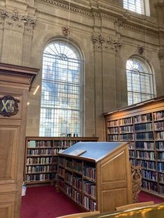 the inside of a library with many bookshelves