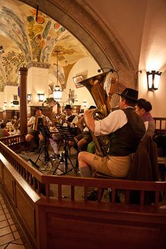 a group of people playing instruments in a room