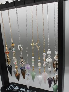 The power of personalized energy with our exquisite Custom Crystal Pendulum. Crafted with precision and intention, each pendulum is a unique masterpiece tailored to your desires. Whether you seek clarity, guidance, or alignment, this bespoke tool is designed to resonate with your energy and amplify your intentions. Our skilled artisans hand-select each crystal, ensuring the highest quality and vibrational resonance. From soothing Amethyst to empowering Tiger Eye, our wide selection of crystals allows you to choose the perfect stone that aligns with your intentions and energy. Personalize your pendulum further with Pendant or design, making it a truly one-of-a-kind treasure. Our customization options add a touch of personal magic to your pendulum. Harness the ancient wisdom of divination an Spiritual Crystal Necklace With Adjustable Chain And Dangle, Dowsing Pendulum, Pendulum Dowsing, Crystal Pendulum, Herbal Magic, Crystal Angels, Witch Jewelry, Divination Tools, Crystal Crafts