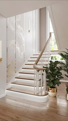 a white staircase in a house with potted plants