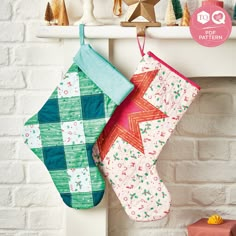 two christmas stockings hanging from a mantle