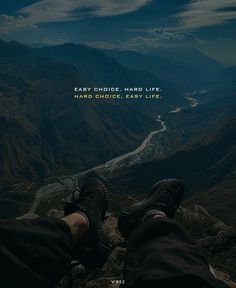 the feet of a person on top of a mountain with a quote above them that says, easy choice - hard life hard choices