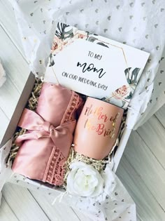 the mother's day gift box includes two mugs and a note