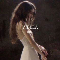 a woman in a white dress holding a knife with the words viella arri on it