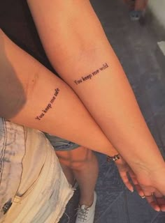 two people with matching tattoos on their legs that say, i love you more than me