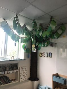 a tree made out of paper hanging from the ceiling