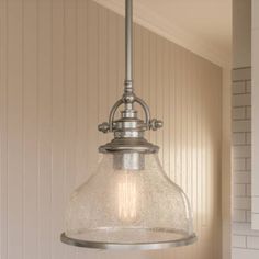 a light fixture hanging from the ceiling in a room