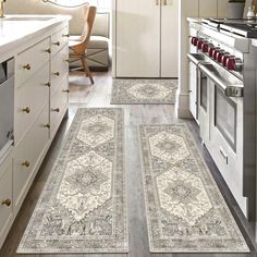 two rugs in the middle of a kitchen