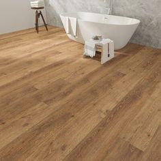 a bath tub sitting on top of a wooden floor