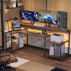 a computer desk with two monitors on it