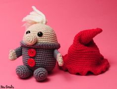 two crocheted stuffed animals sitting next to each other on a pink background,