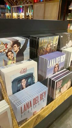 many dvds are stacked on top of each other in a display case at a bookstore