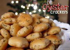 a white bowl filled with potatoes covered in dill oyster crackers