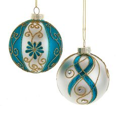 two blue and white christmas ornaments hanging from gold chains on a white background, one with an ornament in the shape of a ribbon