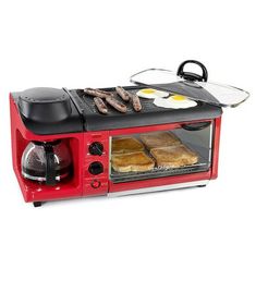 a red toaster oven with food cooking in it