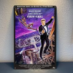 the poster for james bond is displayed on a shelf