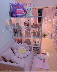 a living room filled with lots of furniture and stuffed animals on top of the shelves