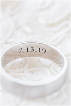 a close up of a wedding ring on a white background with the word 7 13 19