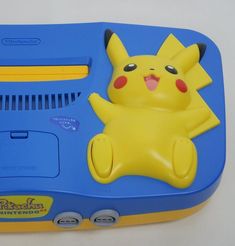 a blue and yellow toy with a pikachu on it's back side