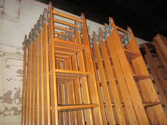 several wooden racks are stacked on top of each other