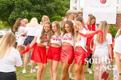 a group of young women standing next to each other