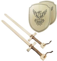 two wooden swords and a plaque with an eagle on it