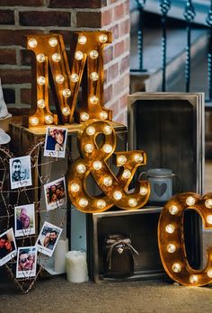 the letters are lit up with lights and pictures