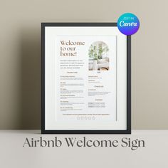 an airbnb welcome sign is displayed in front of a white wall with a black frame