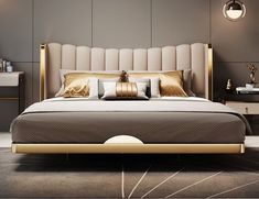 a bed with gold and silver pillows in a modern style bedroom, it has a large headboard