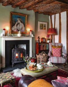 a living room filled with furniture and a fire place in front of a painting on the wall