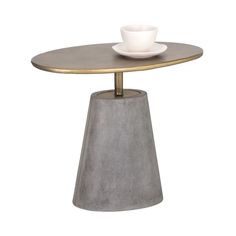 a table with a cup and saucer sitting on it's side, against a white background