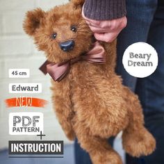 a brown teddy bear being held by someone's hand with instructions on how to tie it