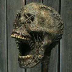 the head of an animal with its mouth open