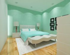 a bed room with a neatly made bed and green walls