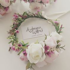 flowers and greenery are arranged on the table