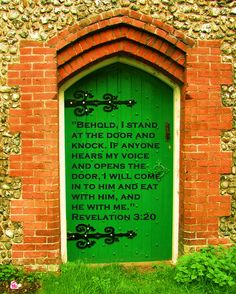 a green door in an old brick building