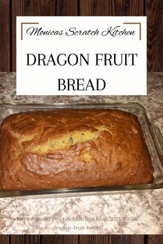 a loaf of bread sitting on top of a counter next to a sign that says dragon fruit bread