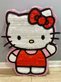 a paper cut out of a hello kitty character